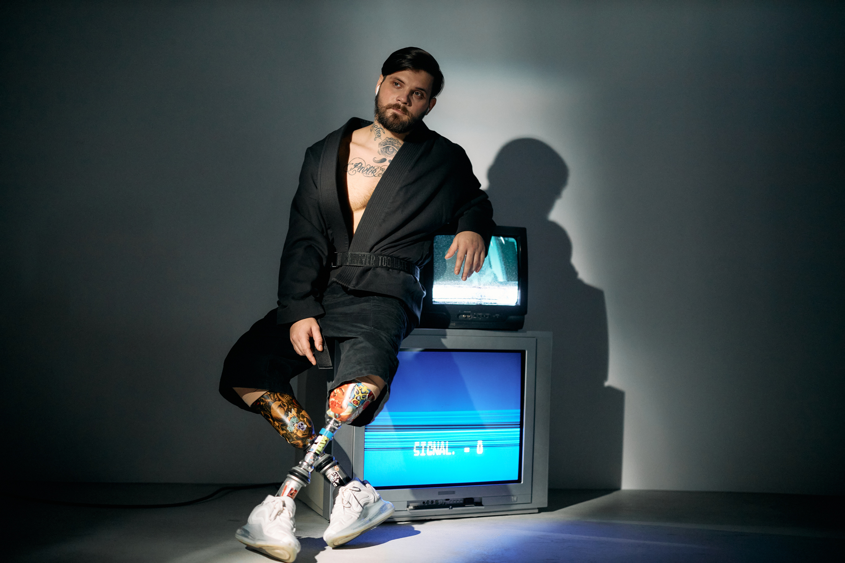 Photo of Man Sitting on Top of Television